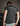 Person wearing a stonewash t-shirt with 'PROTO' logo on the back, standing against a dark background.